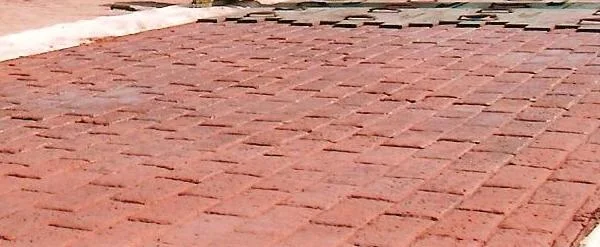 Brick-shaped pattern pressed into colored concrete